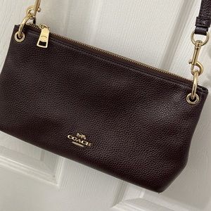 Pre owned Coach burgundy sling bag minor used